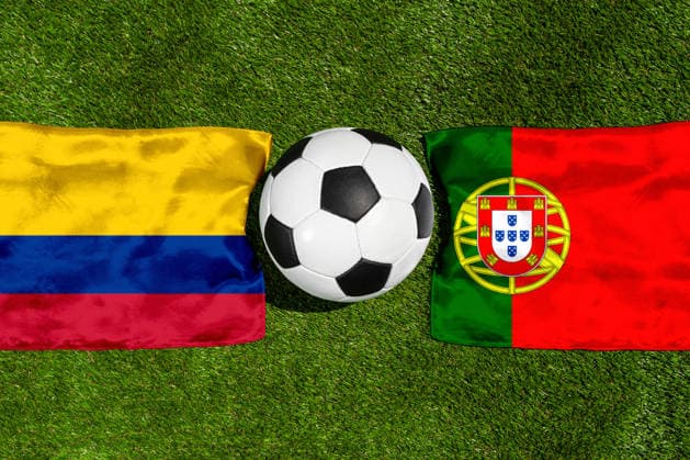 May 22, 2026: PHOTO MONTAGE, 2026 FIFA World Cup, WM, Weltmeisterschaft, Fussball National flags of Colombia and Portugal with a soccer ball on a field. Stock image for the group stage match on June 28 at the 2026 FIFA World Cup *** FOTOMONTAGE, Fußball-Weltmeisterschaft 2026: Nationalflaggen von Kolumbien und Portugal mit Fußball auf Rasen. Symbolbild zum WM-Gruppenspiel am 28 Juni bei der FIFA Fussball-Weltmeisterschaft 2026