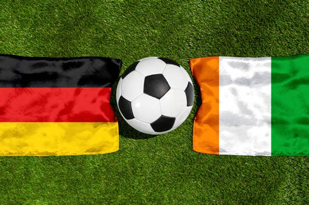 May 22, 2026: PHOTO MONTAGE, 2026 FIFA World Cup, WM, Weltmeisterschaft, Fussball National flags of Germany and Ivory Coast with a soccer ball on the field. Stock image for the group stage match on June 20 at the 2026 FIFA World Cup *** FOTOMONTAGE, Fußball-Weltmeisterschaft 2026: Nationalflaggen von Deutschland und Elfenbeinküste mit Fußball auf Rasen. Symbolbild zum WM-Gruppenspiel am 20 Juni bei der FIFA Fussball-Weltmeisterschaft 2026