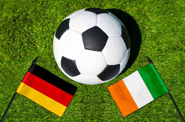 May 22, 2026: PHOTO MONTAGE, 2026 FIFA World Cup, WM, Weltmeisterschaft, Fussball National flags of Germany and Ivory Coast with a soccer ball on the field. Stock image for the group stage match on June 20 at the 2026 FIFA World Cup *** FOTOMONTAGE, Fußball-Weltmeisterschaft 2026: Nationalflaggen von Deutschland und Elfenbeinküste mit Fußball auf Rasen. Symbolbild zum WM-Gruppenspiel am 20 Juni bei der FIFA Fussball-Weltmeisterschaft 2026