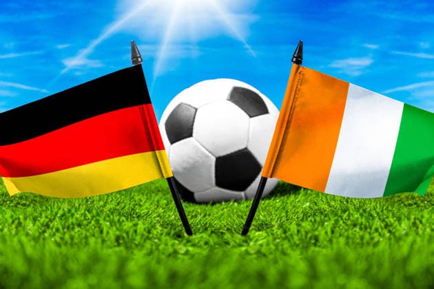 May 22, 2026: PHOTO MONTAGE, 2026 FIFA World Cup, WM, Weltmeisterschaft, Fussball National flags of Germany and Ivory Coast with a soccer ball on the field. Stock image for the group stage match on June 20 at the 2026 FIFA World Cup *** FOTOMONTAGE, Fußball-Weltmeisterschaft 2026: Nationalflaggen von Deutschland und Elfenbeinküste mit Fußball auf Rasen. Symbolbild zum WM-Gruppenspiel am 20 Juni bei der FIFA Fussball-Weltmeisterschaft 2026