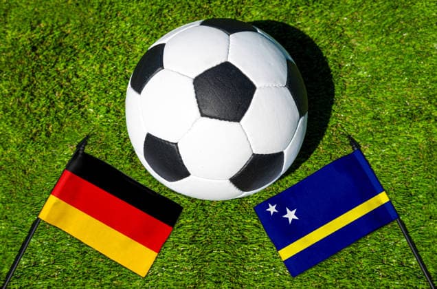 May 22, 2026: PHOTO MONTAGE, 2026 FIFA World Cup, WM, Weltmeisterschaft, Fussball National flags of Germany and Curacao with a soccer ball on the field. Illustrative image for the group stage match on June 14 at the 2026 FIFA World Cup *** FOTOMONTAGE, Fußball-Weltmeisterschaft 2026: Nationalflaggen von Deutschland und Curacao mit Fußball auf Rasen. Symbolbild zum WM-Gruppenspiel am 14 Juni bei der FIFA Fussball-Weltmeisterschaft 2026