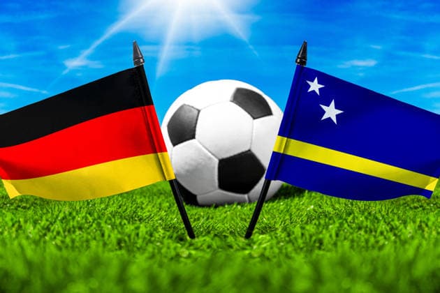 May 22, 2026: PHOTO MONTAGE, 2026 FIFA World Cup, WM, Weltmeisterschaft, Fussball National flags of Germany and Curacao with a soccer ball on the field. Illustrative image for the group stage match on June 14 at the 2026 FIFA World Cup *** FOTOMONTAGE, Fußball-Weltmeisterschaft 2026: Nationalflaggen von Deutschland und Curacao mit Fußball auf Rasen. Symbolbild zum WM-Gruppenspiel am 14 Juni bei der FIFA Fussball-Weltmeisterschaft 2026