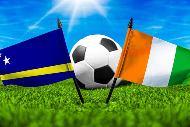 May 22, 2026: PHOTO MONTAGE, 2026 FIFA World Cup, WM, Weltmeisterschaft, Fussball National flags of Curacao and Ivory Coast with a soccer ball on a field. Stock image for the group stage match on June 25 at the 2026 FIFA World Cup *** FOTOMONTAGE, Fußball-Weltmeisterschaft 2026: Nationalflaggen von Curacao und Elfenbeinküste mit Fußball auf Rasen. Symbolbild zum WM-Gruppenspiel am 25 Juni bei der FIFA Fussball-Weltmeisterschaft 2026