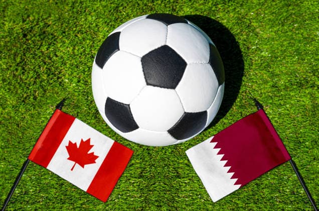 May 22, 2026: PHOTO MONTAGE, 2026 FIFA World Cup, WM, Weltmeisterschaft, Fussball National flags of Canada and Qatar with a soccer ball on the field. Illustrative image for the group stage match on June 19 at the 2026 FIFA World Cup *** FOTOMONTAGE, Fußball-Weltmeisterschaft 2026: Nationalflaggen von Kanada und Katar mit Fußball auf Rasen. Symbolbild zum WM-Gruppenspiel am 19 Juni bei der FIFA Fussball-Weltmeisterschaft 2026