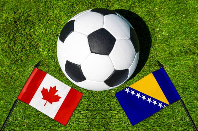 May 22, 2026: PHOTO MONTAGE, 2026 FIFA World Cup, WM, Weltmeisterschaft, Fussball National flags of Canada and Bosnia and Herzegovina with a soccer ball on the field. Illustrative image for the group stage match on June 12 at the 2026 FIFA World Cup *** FOTOMONTAGE, Fußball-Weltmeisterschaft 2026: Nationalflaggen von Kanada und Bosnien Herzegowina mit Fußball auf Rasen. Symbolbild zum WM-Gruppenspiel am 12 Juni bei der FIFA Fussball-Weltmeisterschaft 2026