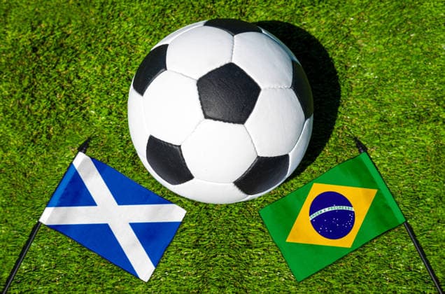 May 22, 2026: PHOTO MONTAGE, 2026 FIFA World Cup, WM, Weltmeisterschaft, Fussball National flags of Scotland and Brazil with a soccer ball on a field. Stock image for the group stage match on June 25 at the 2026 FIFA World Cup *** FOTOMONTAGE, Fußball-Weltmeisterschaft 2026: Nationalflaggen von Schottland und Brasilien mit Fußball auf Rasen. Symbolbild zum WM-Gruppenspiel am 25 Juni bei der FIFA Fussball-Weltmeisterschaft 2026