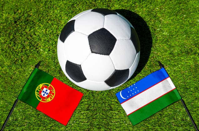 May 22, 2026: PHOTO MONTAGE, 2026 FIFA World Cup, WM, Weltmeisterschaft, Fussball National flags of Portugal and Uzbekistan with a soccer ball on a field. Stock image for the group stage match on June 23 at the 2026 FIFA World Cup *** FOTOMONTAGE, Fußball-Weltmeisterschaft 2026: Nationalflaggen von Portugal und Usbekistan mit Fußball auf Rasen. Symbolbild zum WM-Gruppenspiel am 23 Juni bei der FIFA Fussball-Weltmeisterschaft 2026
