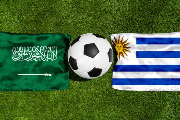 May 22, 2026: PHOTO MONTAGE, 2026 FIFA World Cup, WM, Weltmeisterschaft, Fussball National flags of Saudi Arabia and Uruguay with a soccer ball on the field. Stock image for the group stage match on June 16 at the 2026 FIFA World Cup *** FOTOMONTAGE, Fußball-Weltmeisterschaft 2026: Nationalflaggen von Saudi-Arabien und Uruguay mit Fußball auf Rasen. Symbolbild zum WM-Gruppenspiel am 16 Juni bei der FIFA Fussball-Weltmeisterschaft 2026