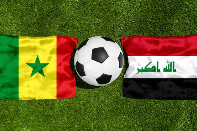 May 22, 2026: PHOTO MONTAGE, 2026 FIFA World Cup, WM, Weltmeisterschaft, Fussball National flags of Senegal and Iraq with a soccer ball on the field. Stock image for the group stage match on June 26 at the 2026 FIFA World Cup *** FOTOMONTAGE, Fußball-Weltmeisterschaft 2026: Nationalflaggen von Senegal und Irak mit Fußball auf Rasen. Symbolbild zum WM-Gruppenspiel am 26 Juni bei der FIFA Fussball-Weltmeisterschaft 2026