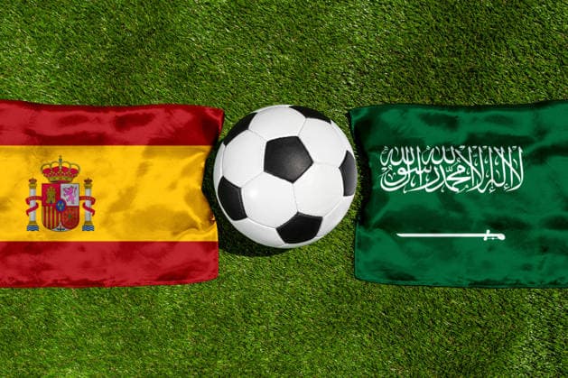 May 22, 2026: PHOTO MONTAGE, 2026 FIFA World Cup, WM, Weltmeisterschaft, Fussball National flags of Spain and Saudi Arabia with a soccer ball on the field. Stock image for the group stage match on June 21 at the 2026 FIFA World Cup *** FOTOMONTAGE, Fußball-Weltmeisterschaft 2026: Nationalflaggen von Spanien und Saudi-Arabien mit Fußball auf Rasen. Symbolbild zum WM-Gruppenspiel am 21 Juni bei der FIFA Fussball-Weltmeisterschaft 2026