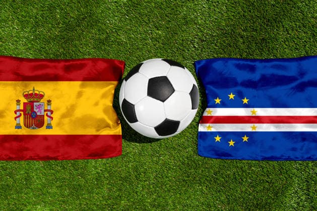 May 22, 2026: PHOTO MONTAGE, 2026 FIFA World Cup, WM, Weltmeisterschaft, Fussball National flags of Spain and Cape Verde with a soccer ball on the grass. Stock image for the group stage match on June 15 at the 2026 FIFA World Cup *** FOTOMONTAGE, Fußball-Weltmeisterschaft 2026: Nationalflaggen von Spanien und Kap Verde mit Fußball auf Rasen. Symbolbild zum WM-Gruppenspiel am 15 Juni bei der FIFA Fussball-Weltmeisterschaft 2026