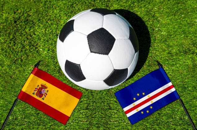 May 22, 2026: PHOTO MONTAGE, 2026 FIFA World Cup, WM, Weltmeisterschaft, Fussball National flags of Spain and Cape Verde with a soccer ball on the grass. Stock image for the group stage match on June 15 at the 2026 FIFA World Cup *** FOTOMONTAGE, Fußball-Weltmeisterschaft 2026: Nationalflaggen von Spanien und Kap Verde mit Fußball auf Rasen. Symbolbild zum WM-Gruppenspiel am 15 Juni bei der FIFA Fussball-Weltmeisterschaft 2026