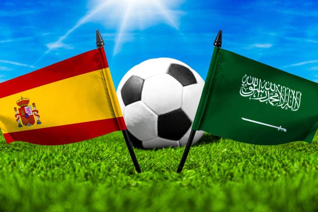 May 22, 2026: PHOTO MONTAGE, 2026 FIFA World Cup, WM, Weltmeisterschaft, Fussball National flags of Spain and Saudi Arabia with a soccer ball on the field. Stock image for the group stage match on June 21 at the 2026 FIFA World Cup *** FOTOMONTAGE, Fußball-Weltmeisterschaft 2026: Nationalflaggen von Spanien und Saudi-Arabien mit Fußball auf Rasen. Symbolbild zum WM-Gruppenspiel am 21 Juni bei der FIFA Fussball-Weltmeisterschaft 2026