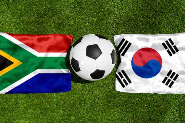 May 22, 2026: PHOTO MONTAGE, 2026 FIFA World Cup, WM, Weltmeisterschaft, Fussball National flags of South Africa and South Korea with a soccer ball on a field. Stock image for the group stage match on June 25 at the 2026 FIFA World Cup *** FOTOMONTAGE, Fußball-Weltmeisterschaft 2026: Nationalflaggen von Südafrika und Südkorea mit Fußball auf Rasen. Symbolbild zum WM-Gruppenspiel am 25 Juni bei der FIFA Fussball-Weltmeisterschaft 2026