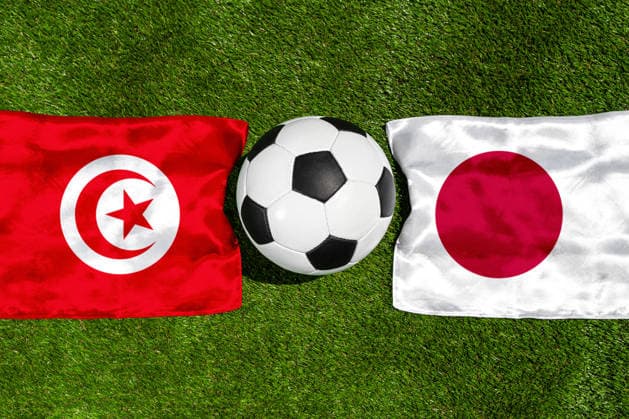 May 22, 2026: PHOTO MONTAGE, 2026 FIFA World Cup, WM, Weltmeisterschaft, Fussball National flags of Tunisia and Japan with a soccer ball on the field. Stock image for the group stage match on June 21 at the 2026 FIFA World Cup *** FOTOMONTAGE, Fußball-Weltmeisterschaft 2026: Nationalflaggen von Tunesien und Japan mit Fußball auf Rasen. Symbolbild zum WM-Gruppenspiel am 21 Juni bei der FIFA Fussball-Weltmeisterschaft 2026