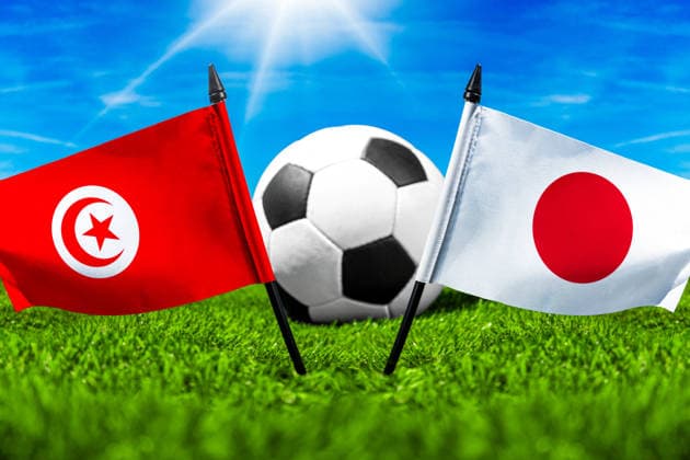 May 22, 2026: PHOTO MONTAGE, 2026 FIFA World Cup, WM, Weltmeisterschaft, Fussball National flags of Tunisia and Japan with a soccer ball on the field. Stock image for the group stage match on June 21 at the 2026 FIFA World Cup *** FOTOMONTAGE, Fußball-Weltmeisterschaft 2026: Nationalflaggen von Tunesien und Japan mit Fußball auf Rasen. Symbolbild zum WM-Gruppenspiel am 21 Juni bei der FIFA Fussball-Weltmeisterschaft 2026