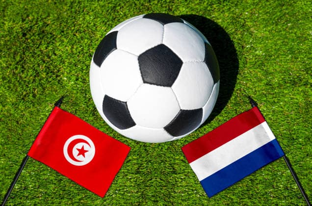 May 22, 2026: PHOTO MONTAGE, 2026 FIFA World Cup, WM, Weltmeisterschaft, Fussball National flags of Tunisia and the Netherlands with a soccer ball on the field. Stock image for the group stage match on June 26 at the 2026 FIFA World Cup *** FOTOMONTAGE, Fußball-Weltmeisterschaft 2026: Nationalflaggen von Tunesien und Niederlande mit Fußball auf Rasen. Symbolbild zum WM-Gruppenspiel am 26 Juni bei der FIFA Fussball-Weltmeisterschaft 2026