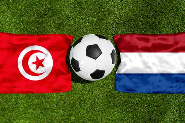 May 22, 2026: PHOTO MONTAGE, 2026 FIFA World Cup, WM, Weltmeisterschaft, Fussball National flags of Tunisia and the Netherlands with a soccer ball on the field. Stock image for the group stage match on June 26 at the 2026 FIFA World Cup *** FOTOMONTAGE, Fußball-Weltmeisterschaft 2026: Nationalflaggen von Tunesien und Niederlande mit Fußball auf Rasen. Symbolbild zum WM-Gruppenspiel am 26 Juni bei der FIFA Fussball-Weltmeisterschaft 2026