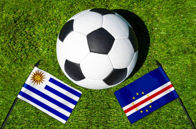 May 22, 2026: PHOTO MONTAGE, 2026 FIFA World Cup, WM, Weltmeisterschaft, Fussball National flags of Uruguay and Cape Verde with a soccer ball on a field. Stock image for the group stage match on June 22 at the 2026 FIFA World Cup *** FOTOMONTAGE, Fußball-Weltmeisterschaft 2026: Nationalflaggen von Uruguay und Kap Verde mit Fußball auf Rasen. Symbolbild zum WM-Gruppenspiel am 22 Juni bei der FIFA Fussball-Weltmeisterschaft 2026