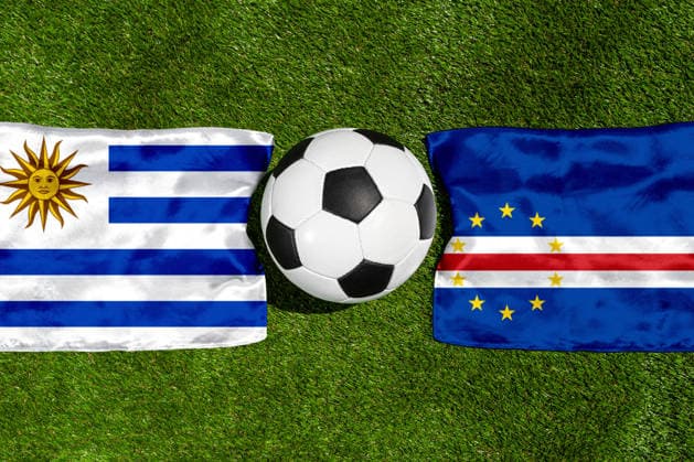 May 22, 2026: PHOTO MONTAGE, 2026 FIFA World Cup, WM, Weltmeisterschaft, Fussball National flags of Uruguay and Cape Verde with a soccer ball on a field. Stock image for the group stage match on June 22 at the 2026 FIFA World Cup *** FOTOMONTAGE, Fußball-Weltmeisterschaft 2026: Nationalflaggen von Uruguay und Kap Verde mit Fußball auf Rasen. Symbolbild zum WM-Gruppenspiel am 22 Juni bei der FIFA Fussball-Weltmeisterschaft 2026