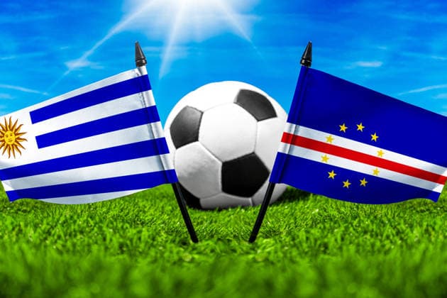 May 22, 2026: PHOTO MONTAGE, 2026 FIFA World Cup, WM, Weltmeisterschaft, Fussball National flags of Uruguay and Cape Verde with a soccer ball on a field. Stock image for the group stage match on June 22 at the 2026 FIFA World Cup *** FOTOMONTAGE, Fußball-Weltmeisterschaft 2026: Nationalflaggen von Uruguay und Kap Verde mit Fußball auf Rasen. Symbolbild zum WM-Gruppenspiel am 22 Juni bei der FIFA Fussball-Weltmeisterschaft 2026