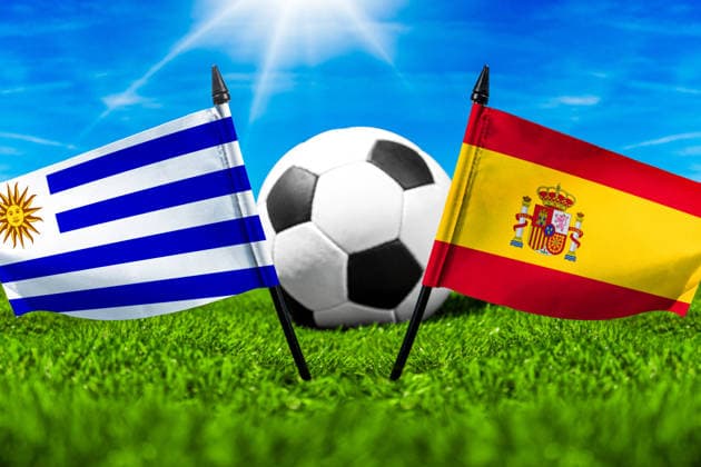 May 22, 2026: PHOTO MONTAGE, 2026 FIFA World Cup, WM, Weltmeisterschaft, Fussball National flags of Uruguay and Spain with a soccer ball on grass. Stock image for the group stage match on June 27 at the 2026 FIFA World Cup *** FOTOMONTAGE, Fußball-Weltmeisterschaft 2026: Nationalflaggen von Uruguay und Spanien mit Fußball auf Rasen. Symbolbild zum WM-Gruppenspiel am 27 Juni bei der FIFA Fussball-Weltmeisterschaft 2026