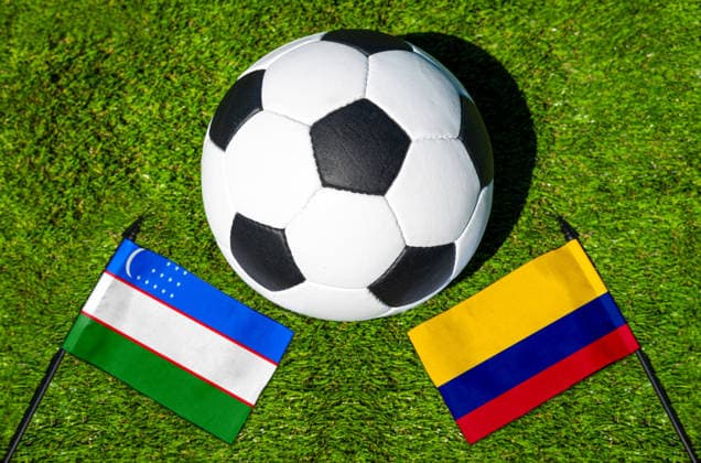 May 22, 2026: PHOTO MONTAGE, 2026 FIFA World Cup, WM, Weltmeisterschaft, Fussball National flags of Uzbekistan and Colombia with a soccer ball on a field. Illustrative image for the group stage match on June 18 at the 2026 FIFA World Cup *** FOTOMONTAGE, Fußball-Weltmeisterschaft 2026: Nationalflaggen von Usbekistan und Kolumbien mit Fußball auf Rasen. Symbolbild zum WM-Gruppenspiel am 18 Juni bei der FIFA Fussball-Weltmeisterschaft 2026