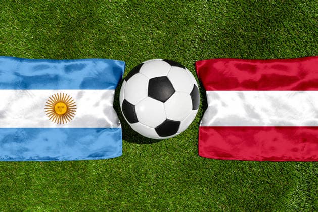 May 22, 2026: PHOTO MONTAGE, 2026 FIFA World Cup, WM, Weltmeisterschaft, Fussball National flags of Argentina and Austria with a soccer ball on the field. Illustrative image for the group stage match on June 22 at the 2026 FIFA World Cup *** FOTOMONTAGE, Fußball-Weltmeisterschaft 2026: Nationalflaggen von Argentinien und Österreich mit Fußball auf Rasen. Symbolbild zum WM-Gruppenspiel am 22 Juni bei der FIFA Fussball-Weltmeisterschaft 2026