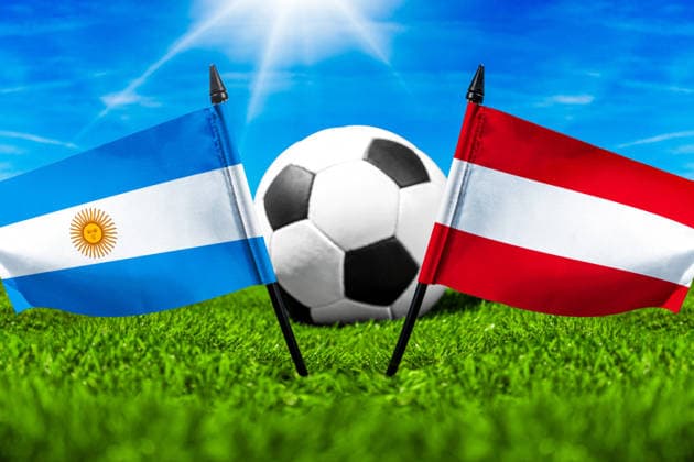 May 22, 2026: PHOTO MONTAGE, 2026 FIFA World Cup, WM, Weltmeisterschaft, Fussball National flags of Argentina and Austria with a soccer ball on the field. Illustrative image for the group stage match on June 22 at the 2026 FIFA World Cup *** FOTOMONTAGE, Fußball-Weltmeisterschaft 2026: Nationalflaggen von Argentinien und Österreich mit Fußball auf Rasen. Symbolbild zum WM-Gruppenspiel am 22 Juni bei der FIFA Fussball-Weltmeisterschaft 2026