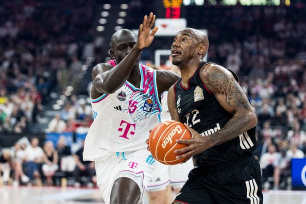 MUNICH, GERMANY - MAY 30: Isiaha Mike (FC Bayern Muenchen, 22) controls the ball against Tylan Birts (Telekom Baskets Bonn, 5) during the easyCredit Basketball Bundesliga Playoffs Semi-final match 1 between FC Bayern Muenchen vs. Telekom Baskets Bonn at SAP Garden on match 1 of easyCredit Basketball Bundesliga Playoffs Semi-final on May 30, 2026 in Munich, Germany. Bavaria Germany Copyright: xSteffiexWunderlx