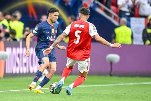 Achraf Hakimi (Paris Saint-Germain FC) and Piero Hincapie (Arsenal FC) battle for the ball during the UEFA Champions League Final 2026 match between Paris Saint-Germain and Arsenal FC at Puskas Arena on May 30, 2026 in Budapest, Hungary. (Photo by Harry Langer DeFodi Images) -