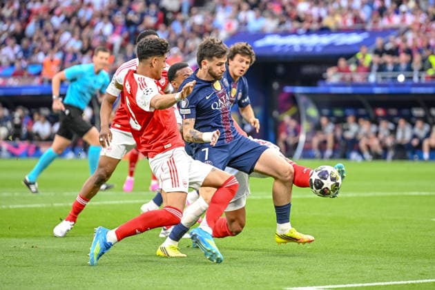 Piero Hincapie (Arsenal FC) and Khvicha Kvaratskhelia (Paris Saint-Germain FC) battle for the ball during the UEFA Champions League Final 2026 match between Paris Saint-Germain and Arsenal FC at Puskas Arena on May 30, 2026 in Budapest, Hungary. (Photo by Harry Langer DeFodi Images) -