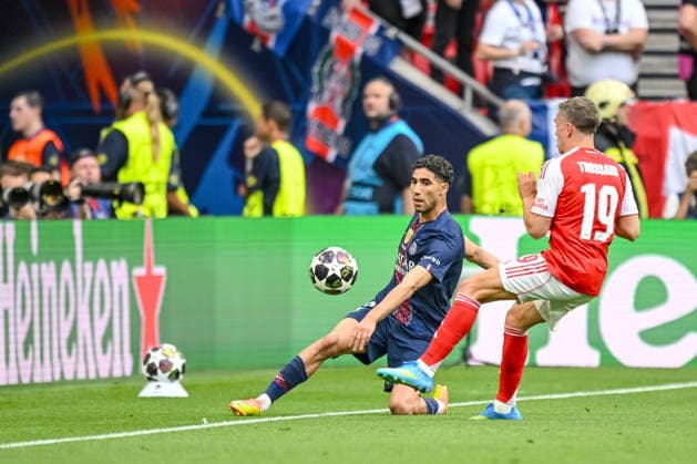 Achraf Hakimi (Paris Saint-Germain FC) and Leandro Trossard (Arsenal FC) battle for the ball during the UEFA Champions League Final 2026 match between Paris Saint-Germain and Arsenal FC at Puskas Arena on May 30, 2026 in Budapest, Hungary. (Photo by Harry Langer DeFodi Images) -