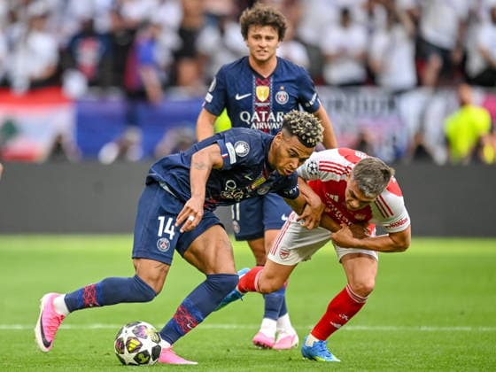 Desire Doue (Paris Saint-Germain FC) and Leandro Trossard (Arsenal FC) battle for the ball during the UEFA Champions League Final 2026 match between Paris Saint-Germain and Arsenal FC at Puskas Arena on May 30, 2026 in Budapest, Hungary. (Photo by Harry Langer DeFodi Images) -