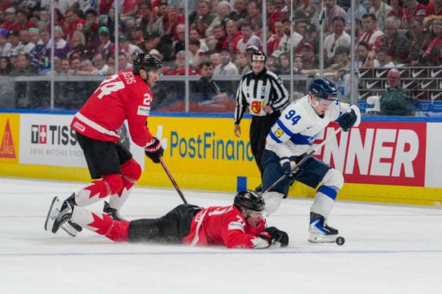 ZURICH, SWITZERLAND - MAY 30: Konsta Helenius of Finland R) take 2minutes penalty for tripping against Macklin Celebrini of Canada lied) during the 2026 IIHF Ice hockey, Eishockey World Championship, WM, Weltmeisterschaft Switzerland game between Canada and Finland at Swiss Life Arena on May 30, 2026 in Zurich, Zurich. Zurich Swiss Life Arena Zurich Switzerland Copyright: xJustPictures.ch JarixPestelaccix jp-en-EuSpIm-JP6_JAR_Canada_Finland_30May2026_00084