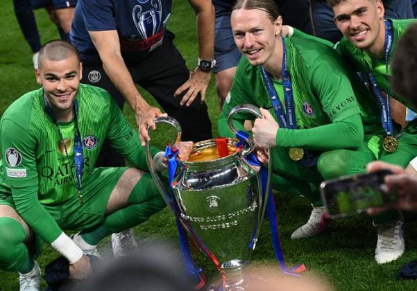 Hungary Soccer Champions League PSG - Arsenal 9177186 30.05.2026 Paris Saint-Germain s goalkeepers Lucas Chevalier, Matvey Safonov and Renato Marin pose with the trophy to celebrate their team™s victory during the award ceremony following the UEFA Champions League final soccer match between Paris Saint-Germain (PSG) and Arsenal at Puskas Arena in Budapest, Hungary. Alexey Filippov Sputnik Budapest Hungary  Copyright: xAlexeyxFilippovx