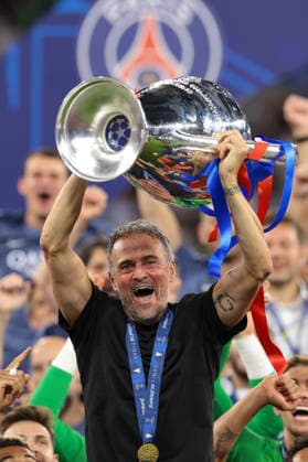 Budapest, Hungary, 30th May 2026. Luis Enrique Head Coach of PSG celebrates with the trophy following the penalty shoot out victory in the Paris Saint Germain vs Arsenal FC UEFA Champions League Final match at Puskas Arena, Budapest. Picture credit should read: Jonathan Moscrop Sportimage EDITORIAL USE ONLY. No use with unauthorised audio, video, data, fixture lists, club league logos or live services. Online in-match use limited to 120 images, no video emulation. No use in betting, games or single club league player publications. SPI_035_PSG_ARSENAL_UCL SPI-4825-0035