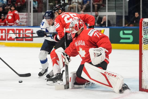 xxkeikkaxx 20260530 Swiss Life Arena, Zurich, Switzerland. IIHF Ice hockey, Eishockey World Championships Semifinal match Canada vs Finland Konsta Helenius (94) of Team Finland and Darnell Nurse (25) of Team Canada battle in front of the Canadian net. Jet Greaves (73) keeps an eye of the puck. Photo by Pasi Suokko All Over Press  1.06241234