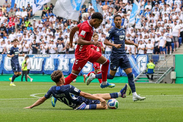 31.05.2026, xhettx, Fussball DM A-Junioren , TSG 1899 Hoffenheim - 1. FC Köln v.l. Maximilian Raphael Theuer (TSG Hoffenheim U19, 12) mit der grätsche gegen David Fürst (1 FC Köln U19, 2) (DFL DFB REGULATIONS PROHIBIT ANY USE OF PHOTOGRAPHS as IMAGE SEQUENCES and or QUASI-VIDEO)