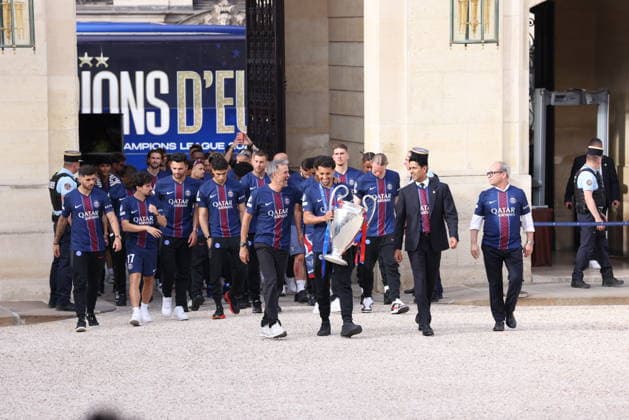 Ceremony at the Elysee for 2026 PSG UEFA Victory – Paris Captain Marquinhos carrying The Trophy with UEFA Champions League winner Paris Saint-Germain Team, , Spanish coach Luis Enrique and Qatari president Nasser al-Khelaifi arriving for a reception at the Elysee presidential palace in Paris, France on May 31, 2026, a day after PSG won the 2026 final football match against Arsenal in Budapest. Photo by Jerome Domine ABACAPRESS.COM Paris France  Copyright: xDominexJerome ABACAx