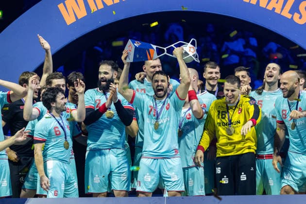 Mohamed Amine Darmoul (MT Melsungen) lifts the EHF-Cup at the award ceremony during the handball final of the Winamax EHF Finals 2026 between THW Kiel and MT Melsungen at Barclays Arena on May 31, 2026 in Hamburg, Germany. -