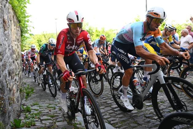 Tour de Wallonie 2026 Stage 1 LOBBES, BELGIUM - JUNE 01 : Taminaux Lionel (BEL) of Lotto Intermarche and Van Asbroeck Tom (BEL) of NSN Cycling Team in action during stage 1 of the 47th edition of Ethias Tour de Wallonie an UCI ProSeries 2.Pro cycling road race stage for Men Elite of 180.7 km with start in Manage and finish in Lobbes on June 1, 2026 in Lobbes, Belgium, 01 06 2026 ( Motordriver Pieter Van Herzele - Lobbes Belgium  Copyright: xVincentxKalutx