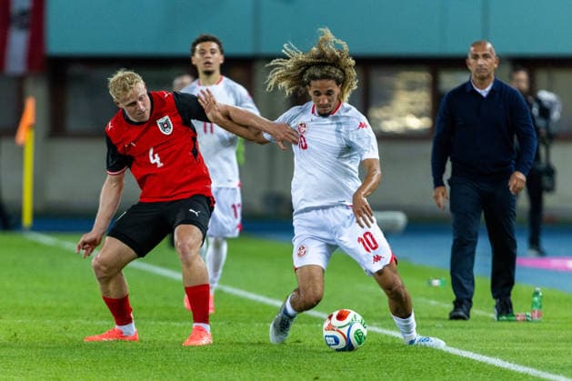 SOCCER - AUT vs TUN, test match VIENNA,AUSTRIA,01.JUN.26 - SOCCER - OEFB international test match, Austria vs Tunisia. Image shows Xaver Schlager (AUT) and Hannibal Mejbri (TUN).  GEPAxpictures xPhilippxBrem