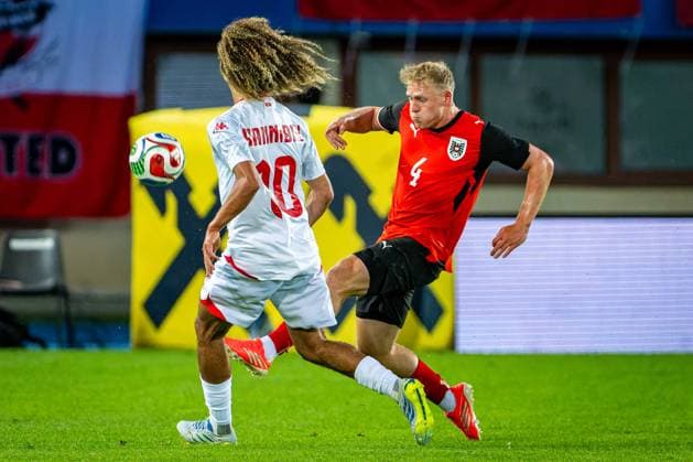SOCCER - AUT vs TUN, test match VIENNA,AUSTRIA,01.JUN.26 - SOCCER - OEFB international test match, Austria vs Tunisia. Image shows Hannibal Mejbri (TUN) and Xaver Schlager (AUT).  GEPAxpictures xKevinxHackner