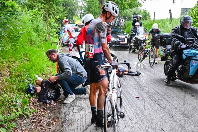 Tour de Wallonie 2026 Stage 2 LIBRAMONT-CHEVIGNY, BELGIUM - JUNE 02 : Walls Matthew (GBR) of Team Storck - MRW Bau in a crash during stage 2 of the 47th edition of Ethias Tour de Wallonie an UCI ProSeries 2.Pro cycling road race stage for Men Elite of 192.1 km with start in Jodoigne and finish in Libramont-Chevigny on June 2, 2026 in Libramont-Chevigny, Belgium, 02 06 2026 ( Motordriver Pieter Van Herzele - Libramont-Chevigny Belgium  Copyright: xVincentxKalutx