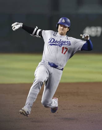 Baseball: Dodgers vs. Diamondbacks Los Angeles Dodgers designated hitter Shohei Ohtani slides into third base after hitting a two-run triple in the second inning of a baseball game against Arizona Diamondbacks at Chase Field in Phoenix, Arizona, on June 2, 2026.  A14AA0005617511P