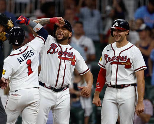 Pinch hitter Dominic Smith 7 of the Toronto Blue Jays celebrates with Ozzie Albies while Matt Olson 28 looks on after Albies hits a 3-run home run in the seventh inning against the Toronto Blue Jays at Truist Park on Wednesday, June 3, 2026 in Atlanta, Georgia.  ATL20260603217 MikexZarrilli