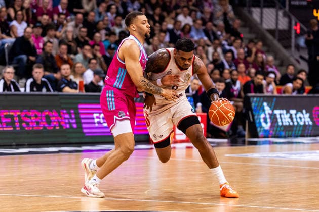 BONN, GERMANY - JUNE 04: Xavier Rathan-Mayes (FC Bayern Muenchen, 4) controls the ball against Alijah Comithier (Telekom Baskets Bonn, 2) during the easyCredit Basketball Bundesliga Playoffs Semi-final match 3 between Telekom Baskets Bonn vs. FC Bayern Muenchen at Telekom Dome Bonn on match 3 of easyCredit Basketball Bundesliga Playoffs Semi-final on June 04, 2026 in Bonn, Germany. North Rhine Westphalia Germany Copyright: xSteffiexWunderlx