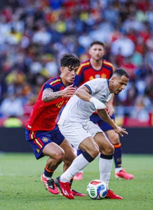 Spain v Iraq - Friendlies A CORUNA, SPAIN - JUNE 04. Marc Bernal of Spain (L) battles for the ball with Ali Al-Hamadi of Iraq (R) during the friendly match between the Spanish national team, Nationalteam and the Iraqi national team at the Riazor Stadium in A Coruna, Spain on June 4, 2026. Pablo Garcia Sacristan Anadolu A Coruna Spain. Editorial use only. Please get in touch for any other usage.  Copyright: x2026xAnadoluxPabloxGarciaxSacristanx