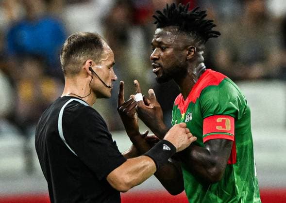 Russia Soccer Friendly Russia - Burkina Faso 9183423 05.06.2026 Referee Nenad Minakovic listens to Burkina Faso s Edmond Tapsoba during the friendly soccer match between Russia and Burkina Faso at Volgograd Arena stadium, in Volgograd, Russia. Maksim Blinov Sputnik Volgograd Russia  Copyright: xMaksimxBlinovx